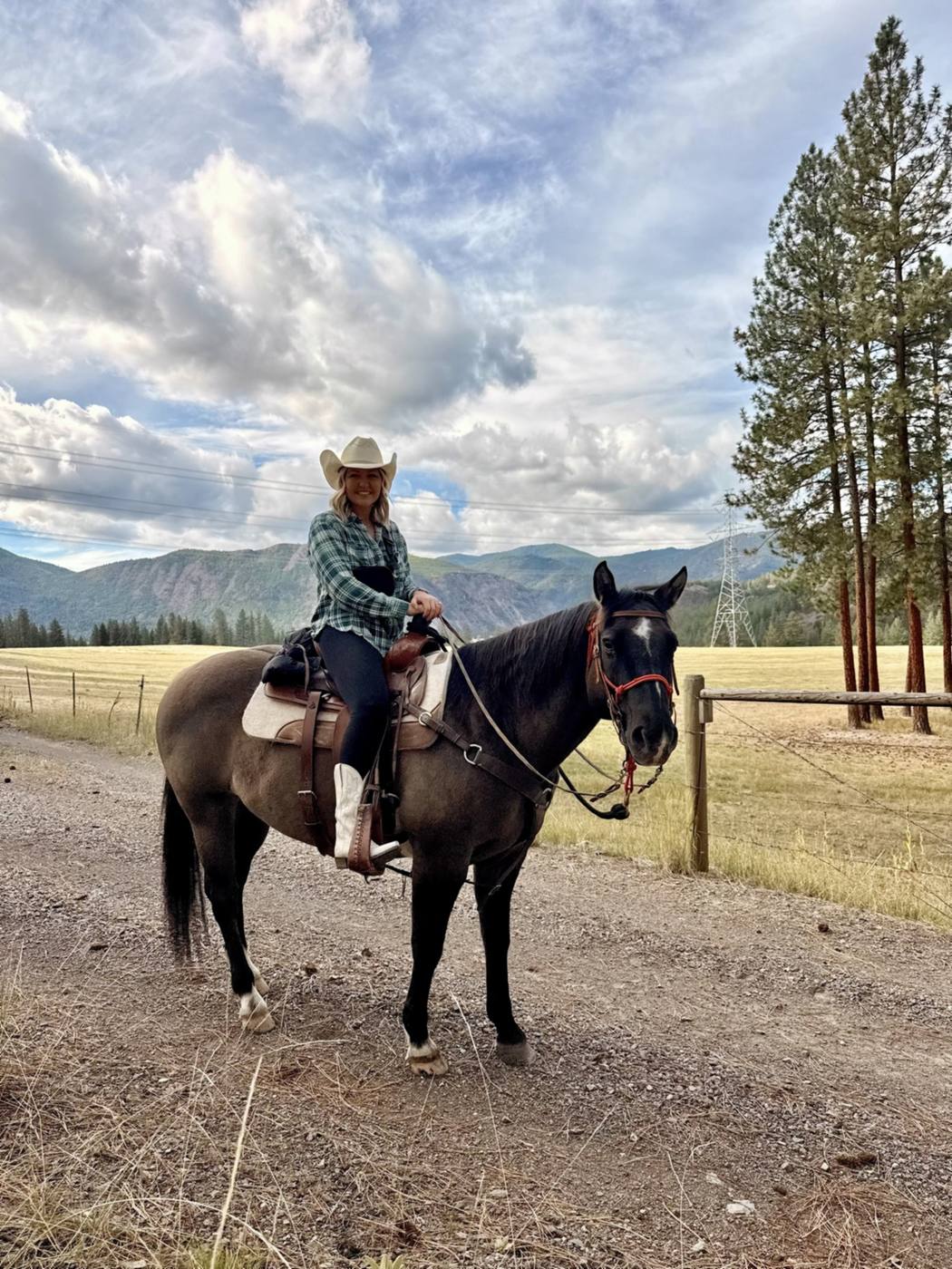 Adele in a cowboy hat on horseback at Riverview Ranch, Montana